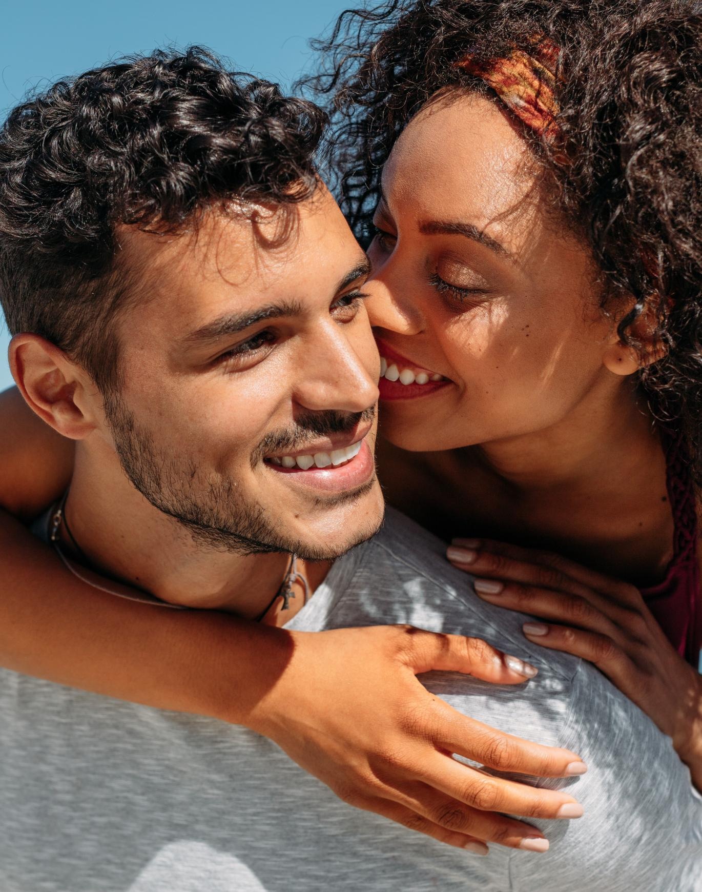 a man and woman embracing